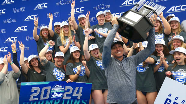The Virginia women's swimming & diving team celebrates winning the 2024 ACC Championship at Greensboro Aquatic Center.